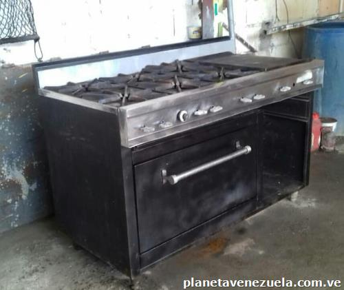 Vendo cocina industrial de 6 hornillas con horno, plancha y gratinador usada